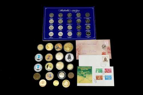 A group of medallions, collectable coins and first day covers