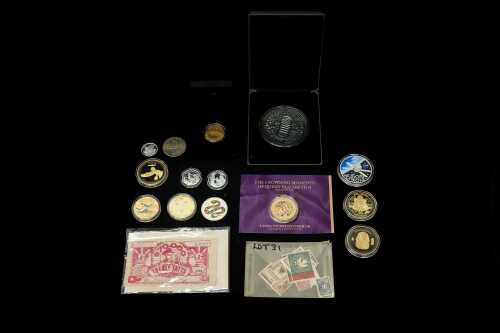 A tin of medallions and collectable coins