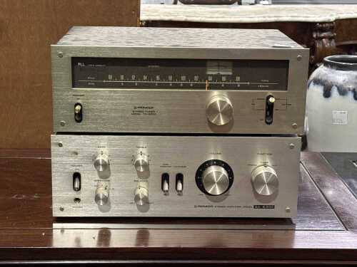 Two Pioneer stereo components including amplifier and radio tuner