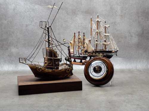 Nautical decorative items, including three model ships and a barometer