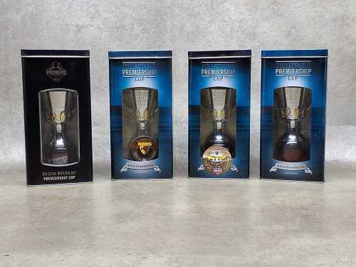 Four Hawthorn AFL replica Premiership Cups in tins
