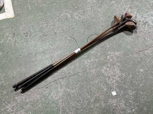 Five timber and metal golf clubs