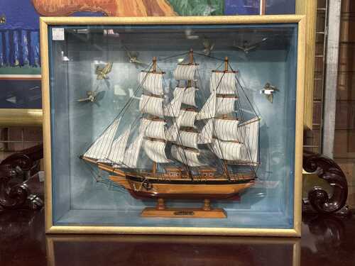 Cutty Sark timber model ship in a glass-front nautical shadow box