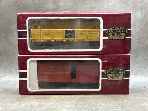 Two Delton Lines G-scale model train box cars in original boxes