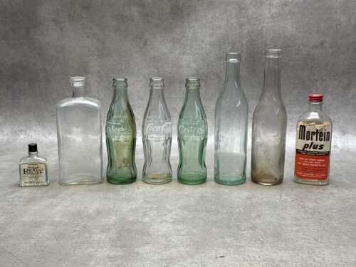 Glass bottles, including Mortein Plus