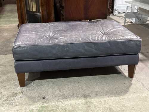 Leather-upholstered ottoman