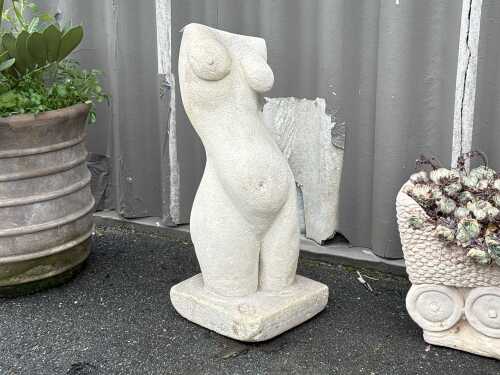 Concrete torso sculpture