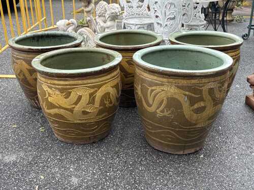 Five glazed ceramic garden planters with dragon motif