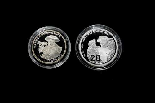 Two commemorative coins, One 0.999 and one 0.500 silver, totalling 23.36 grams