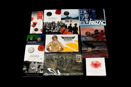 Group of assorted remembrance collectable coins and PNCs, including coloured $2 poppy coin