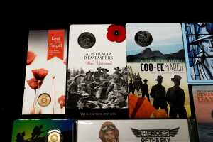 Group of assorted remembrance collectable coins and PNCs, including coloured $2 poppy coin - 2