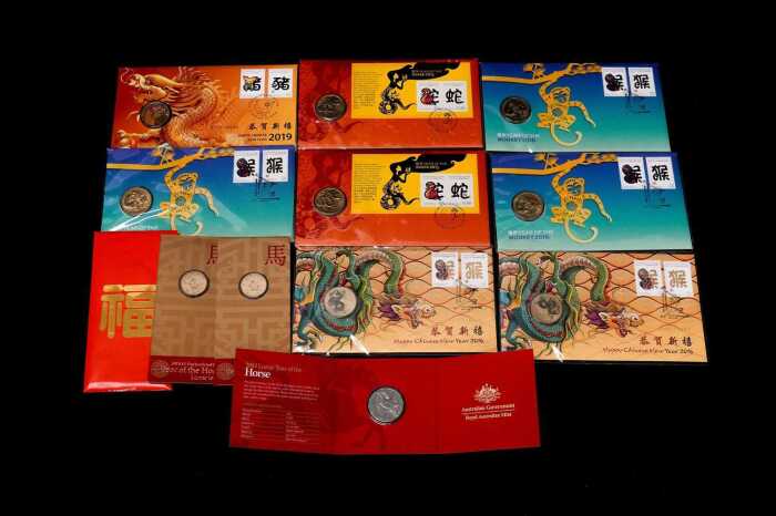 Group of assorted Lunar New Year collectable coins and PNCs