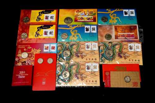 Group of assorted Lunar New Year collectable coins and PNCs