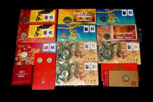 Group of assorted Lunar New Year collectable coins and PNCs