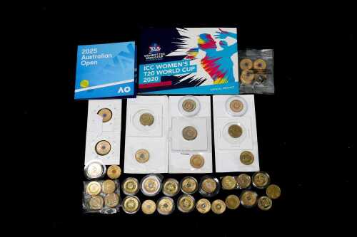 A group of Australian $2 coins, mostly coloured