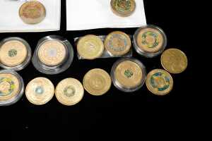 A group of Australian $2 coins, mostly coloured - 3