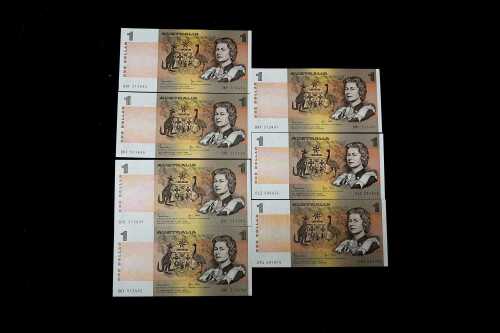 Seven UNC Australian $1 paper banknotes
