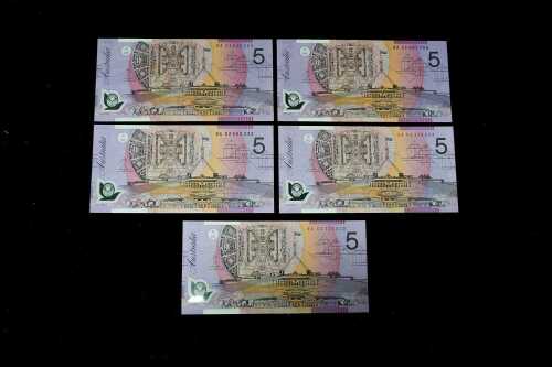 Five early polymer $5 notes