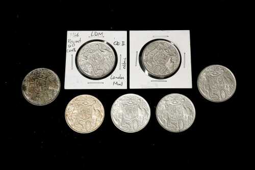 Seven Australian round 0.800 silver 50 cent coins