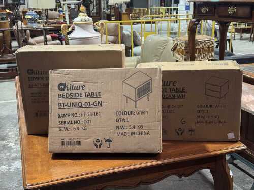 Three Ikiture flat-pack bedside tables