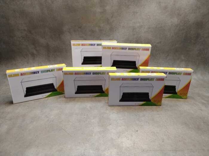 Six Elim Assembly Display Cases, new and sealed