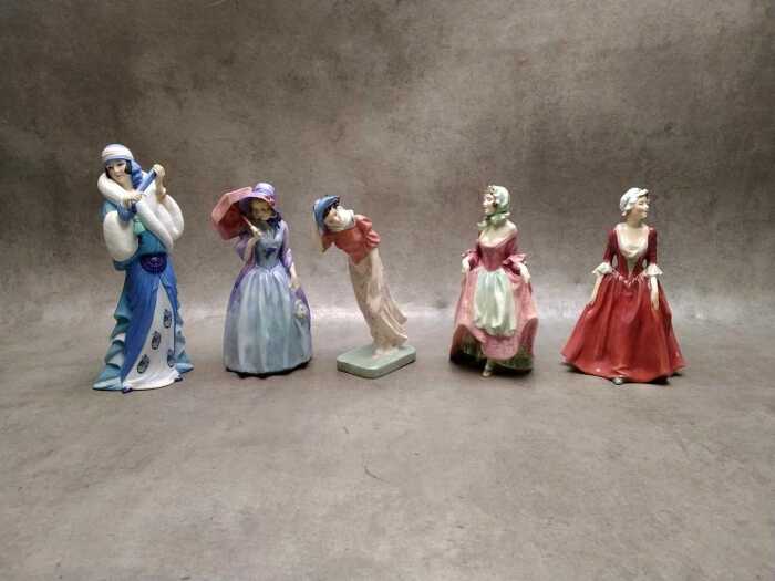 Four Royal Doulton porcelain figures, including Miss Demure