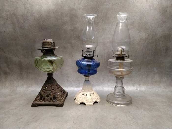 Three antique kerosene lamps