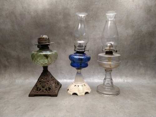 Three antique kerosene lamps