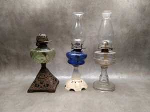 Three antique kerosene lamps