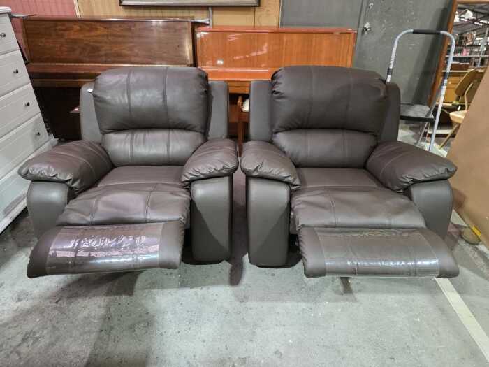 Pair of brown leather reclining armchairs
