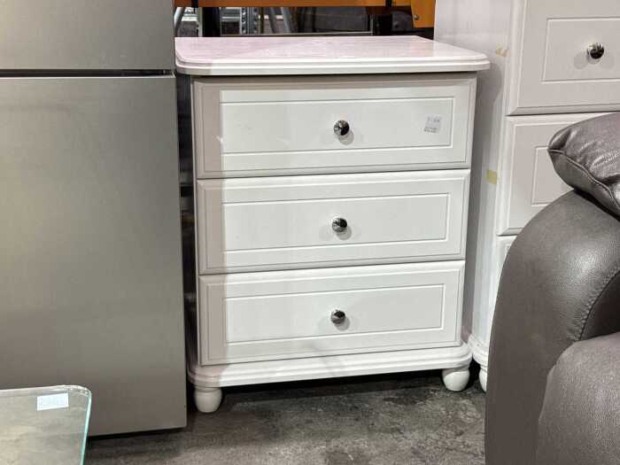 White painted three-drawer bedside table
