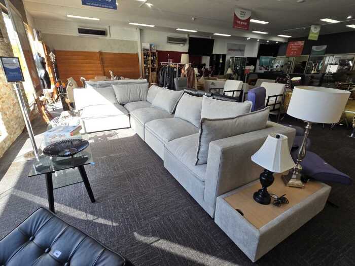 Contemporary modular lounge with two matching storage ottomans