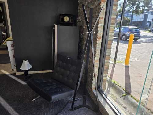 Italian-style modern black steel-framed coat rack