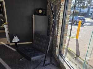 Italian-style modern black steel-framed coat rack