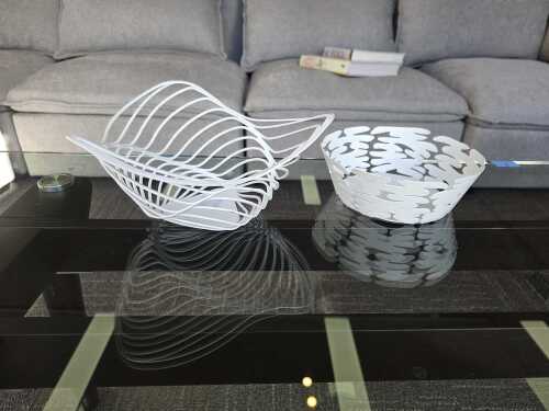 Two Alessi white decorative metal bowls