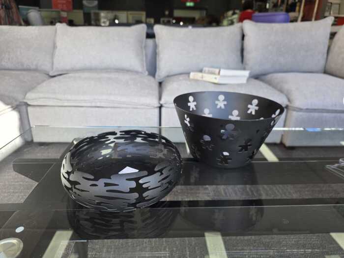 Two Alessi black decorative metal bowls