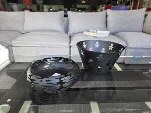Two Alessi black decorative metal bowls