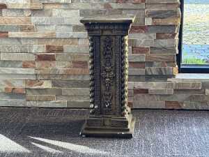 Ornate carved plinth