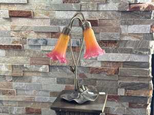 Twin branch glass and brass table lamp with pink and orange lily shades