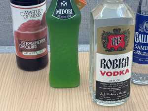 Mixed spirits, liqueurs and cocktail mixer, five bottles - 2