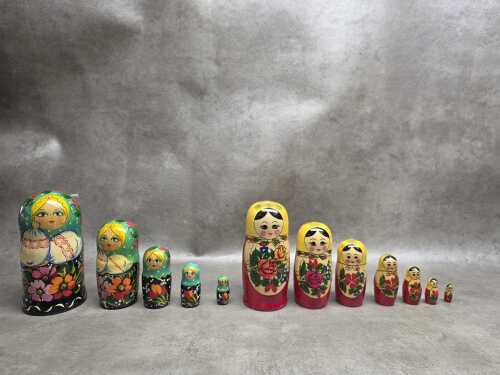 Two hand-painted timber Bubushka nesting dolls