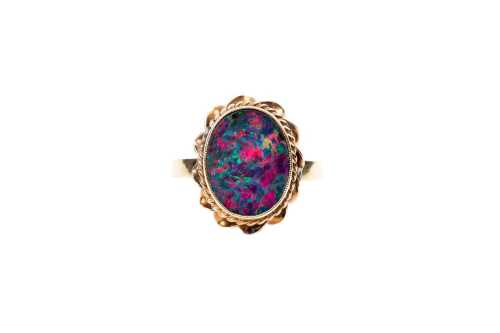 An opal doublet ring in 9 carat yellow gold