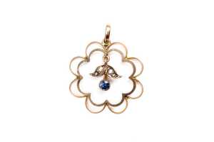 An antique sapphire and pearl pendant in 9 carat yellow gold