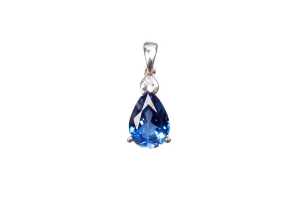 A synthetic sapphire and natural diamond pendant in 9 carat white gold