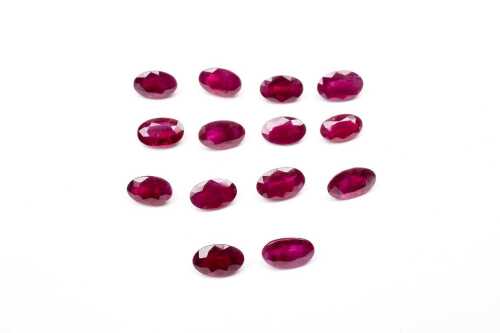 A collection of fourteen natural oval rubies