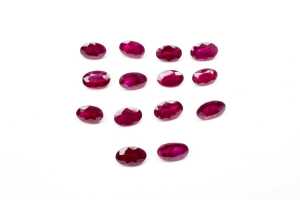 A collection of fourteen natural oval rubies