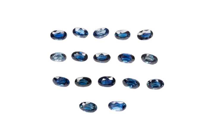 A collection of seventeen oval natural sapphires