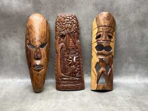 Carved timber decorative items, including masks, wall panels, spears - 2