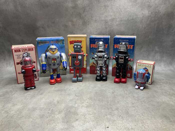 Six mechanical robot toys, some new, all boxed