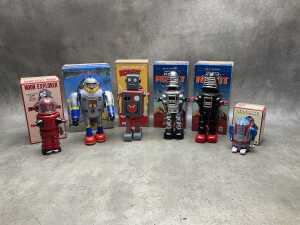 Six mechanical robot toys, some new, all boxed